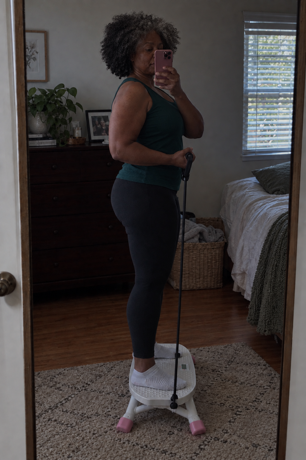 Angie in a side-on mirror pose with the Stridon trainer